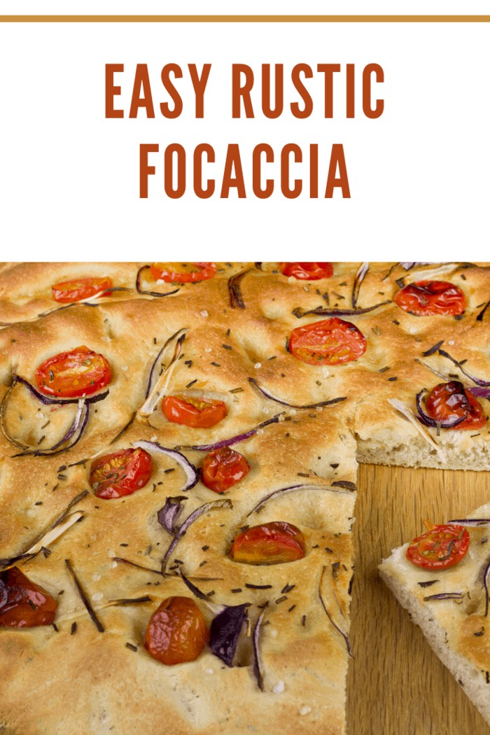 A slice from a loaf of fresh Focaccia Bread.