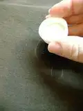 pouring rubbing alcohol on grease stain