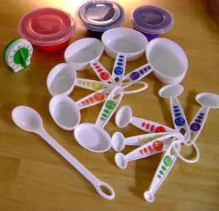 curious chef measuring cups and bowls