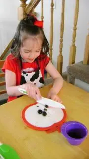 using curious chef knife to cut olives