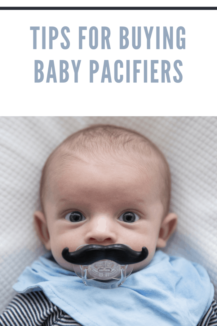 baby with mustache pacifier