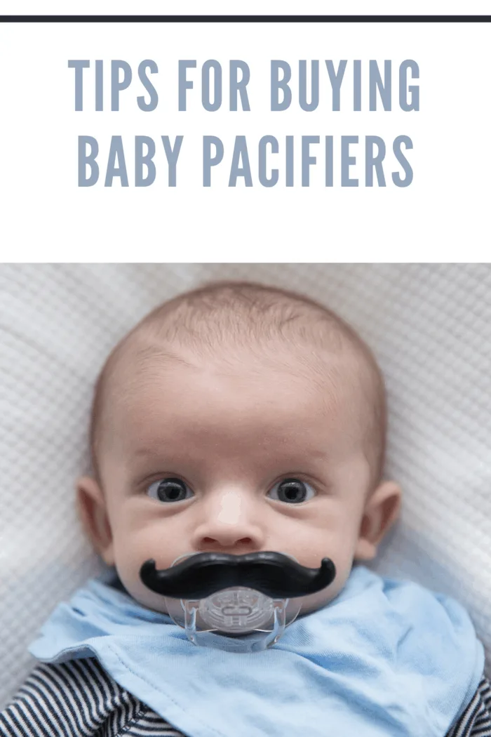 baby with mustache pacifier