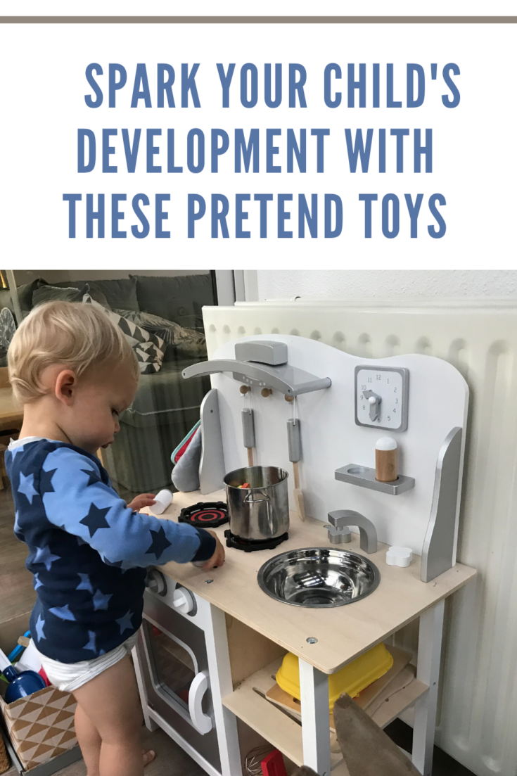 Playing with toy kitchen