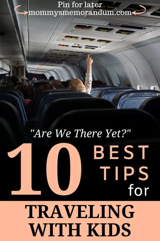 Young child reaching for the ceiling on an airplane, highlighting travel moments with children on flights.