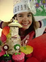 girl with cake made with chef tools three tier magic pans