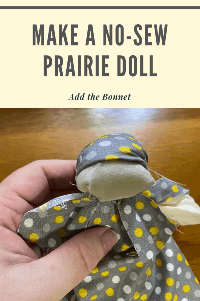 Add the bonnet by folding the 1.75-inches x9-inches piece of fabric over the doll's head and tie around her neck with a piece of yarn or like a bandanna.