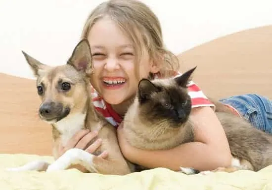 laughing girl with pets