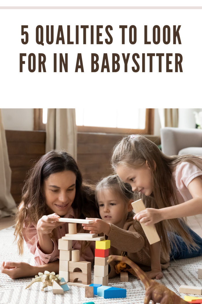 babysitter playing blocks with children