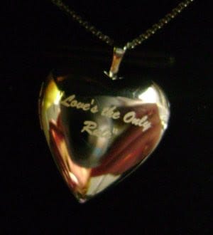 love is the only rule locket pictures on gold