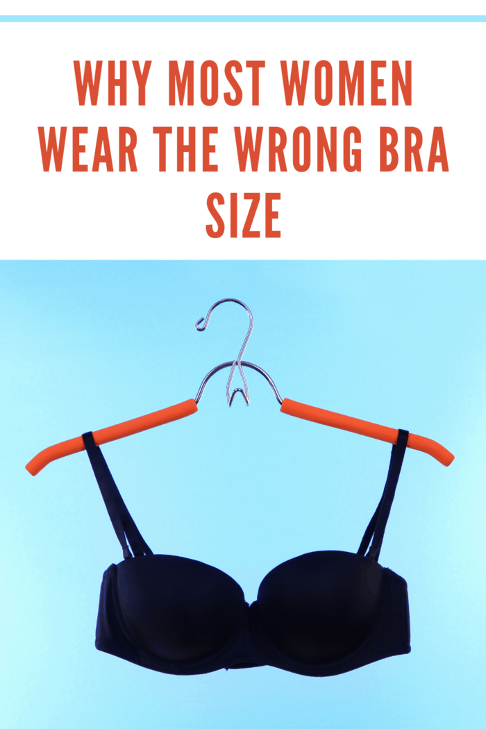 Black bra on hanger with blue backdrop showcasing why most women wear the wrong bra size