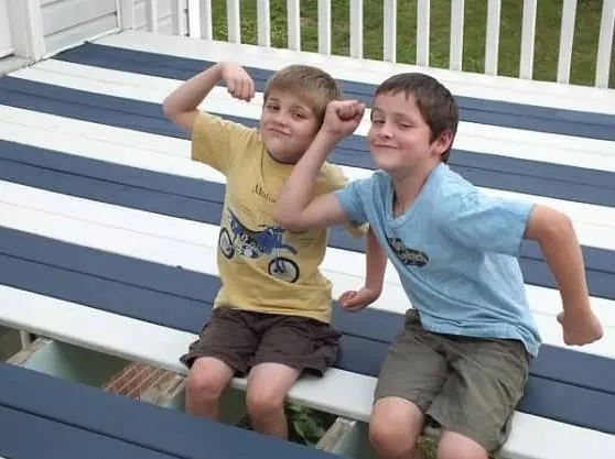 Deck painted with HGTV Home Exterior Paint in navy blue and white stripes