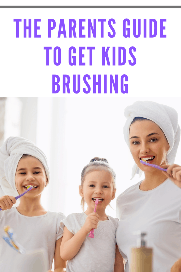 mother with two small girls brushing teeth together