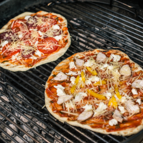 round pizzas on grill