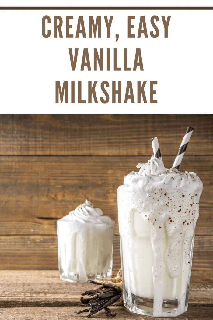 Easy vanilla milkshake with a straw and garnished with a fresh vanilla bean for a classic touch