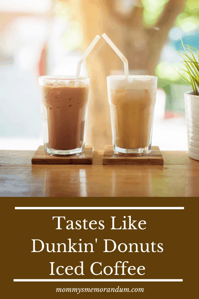 Two glasses of iced coffee with straws on a wooden table, labeled 'Tastes Like Dunkin' Donuts Iced Coffee.