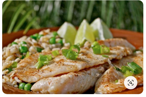 Grilled lime fish fillets with buttery lime glaze served with fresh lime wedges for a zesty summer dish