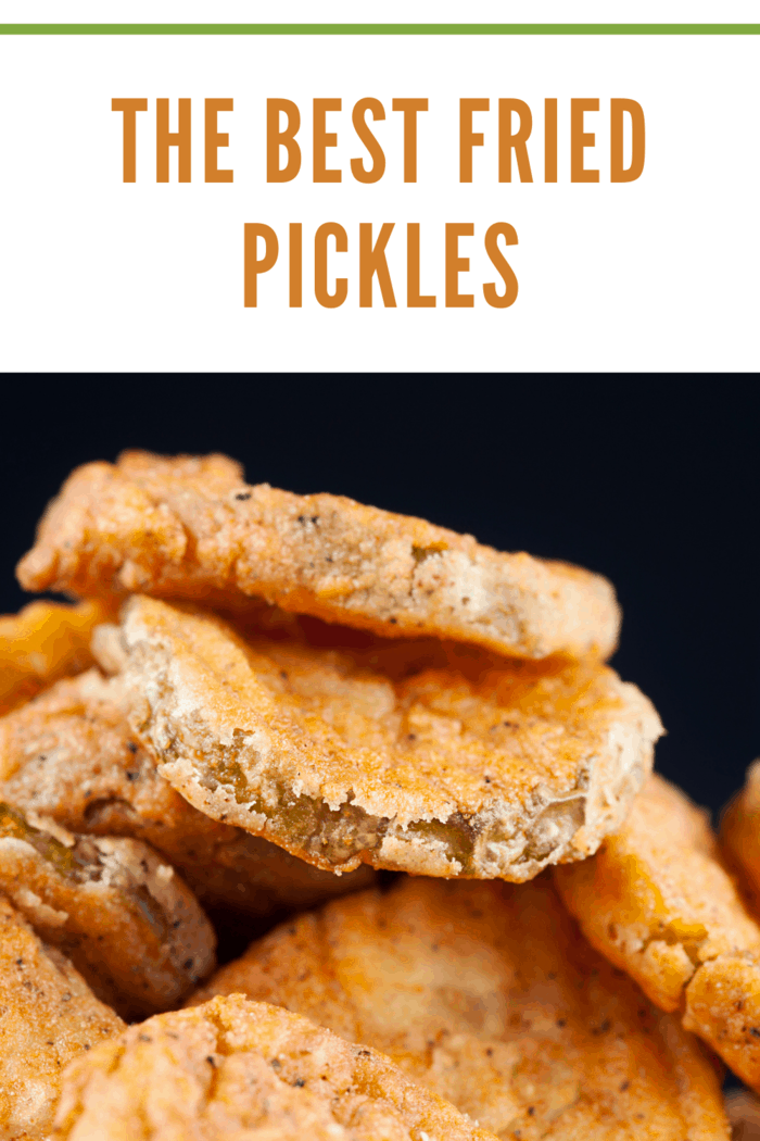 Crispy homemade fried pickles with a golden coating, served with dipping sauce, showcasing how to make fried pickles at home.