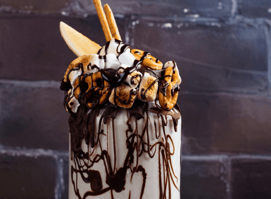 Chocolate Toasted Marshmallow Shake with Graham Cracker Crumbs Chocolate toasted marshmallow shake topped with gooey marshmallows and graham cracker crumbs for a s'mores inspired milkshake