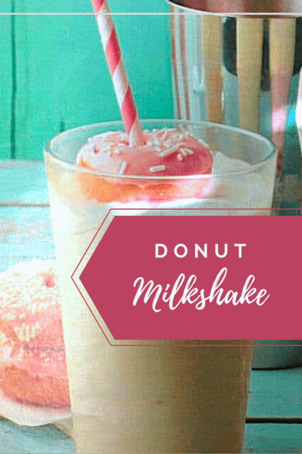 Creamy donut milkshake topped with mini donuts and sprinkles, showcasing the ultimate dessert treat