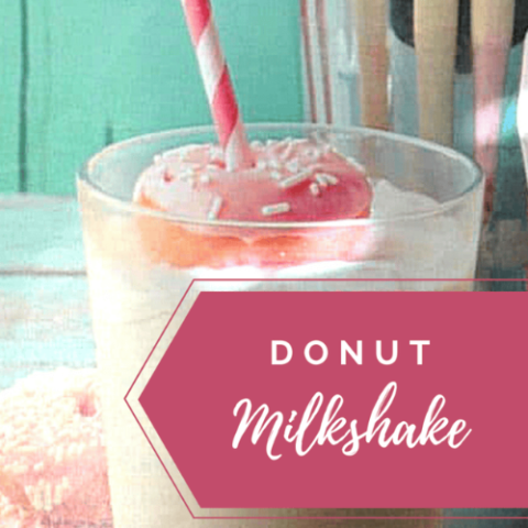 Creamy donut milkshake topped with mini donuts and sprinkles, showcasing the ultimate dessert treat