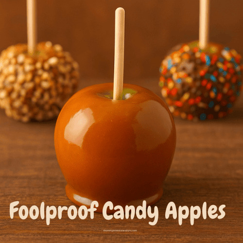 A shiny caramel apple in the foreground with three caramel apples in the background—one topped with chopped nuts, another with chocolate chips, and the third with colorful sprinkles—on a rustic wooden table. Text overlay reads: “Drop the Stick, It’s Caramel Apple Time.”