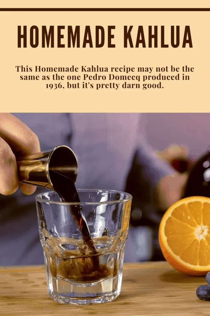 Pouring homemade Kahlua from a jigger into a rocks glass for a DIY Kahlua cocktail recipe