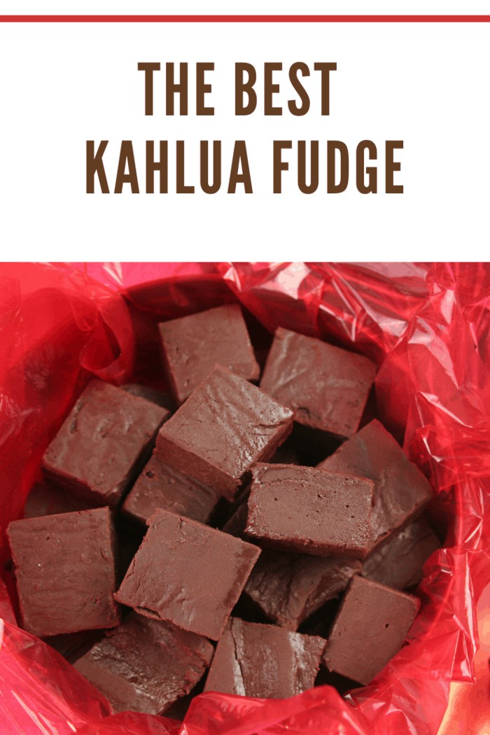 a closeup of homemade kahlua fudge in a holiday tin for gift giving.