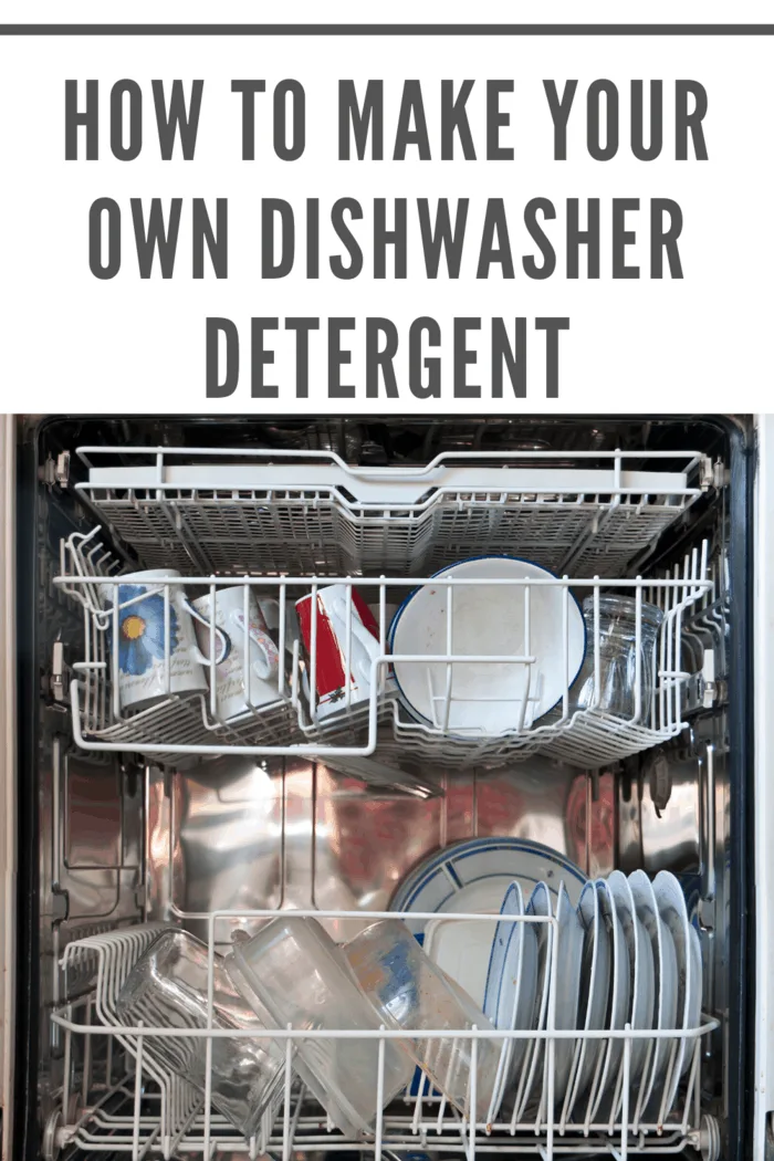 Open dishwasher showcasing clean dishes after using homemade detergent cubes