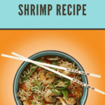 Overhead view of a bowl of ramen with shrimp, garnished with green onions and sesame seeds