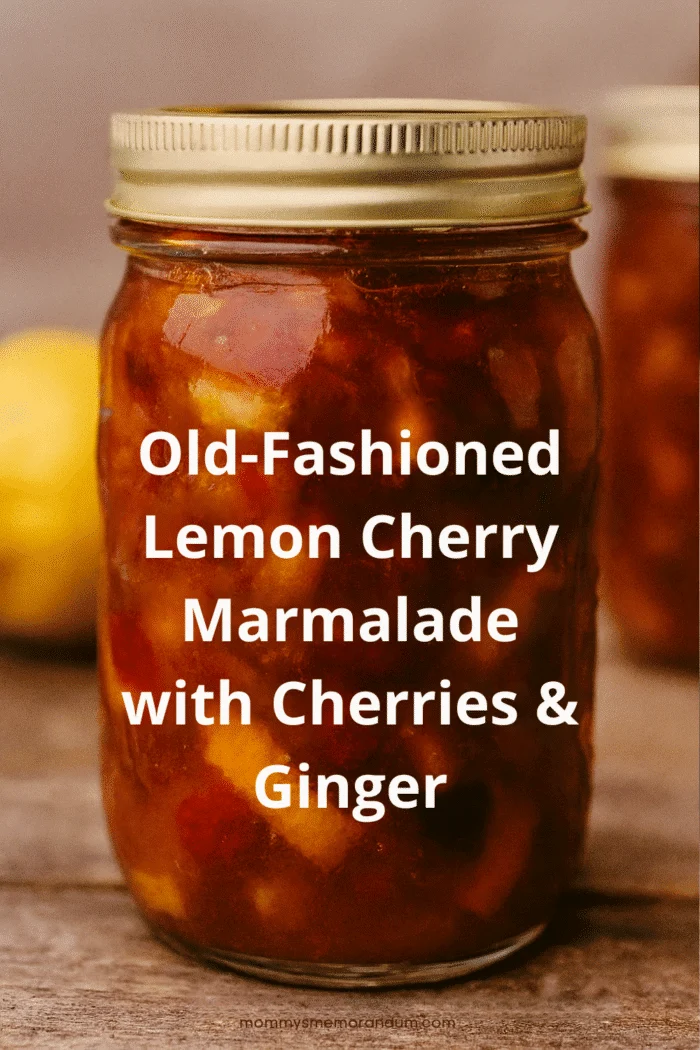 Holiday styled jar of Lemon Cherry Marmalade with ginger and pine decor