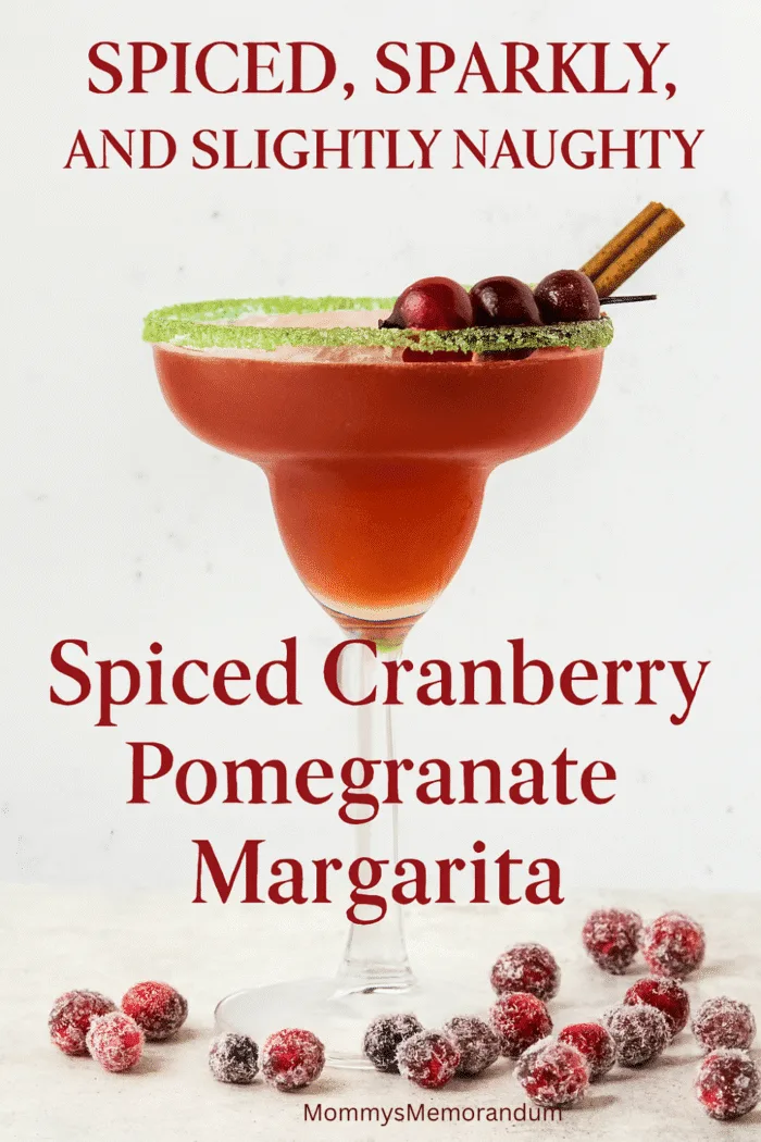 A festive margarita in a sugar-rimmed glass garnished with cranberries and a cinnamon stick, surrounded by sugared cranberries. Text overlay reads 'Spiced, Sparkly, and Slightly Naughty' with subtitle 'Spiced Cranberry Pomegranate Margarita.' Holiday-themed cocktail image with warm lighting and cozy seasonal vibes.