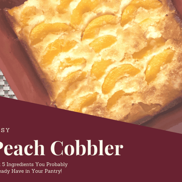 Close-up of a homemade peach cobbler with golden-brown crust and peach slices in a red baking dish