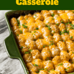 Delicious easy white trash casserole featuring ground beef and tater tots in a vibrant green dish