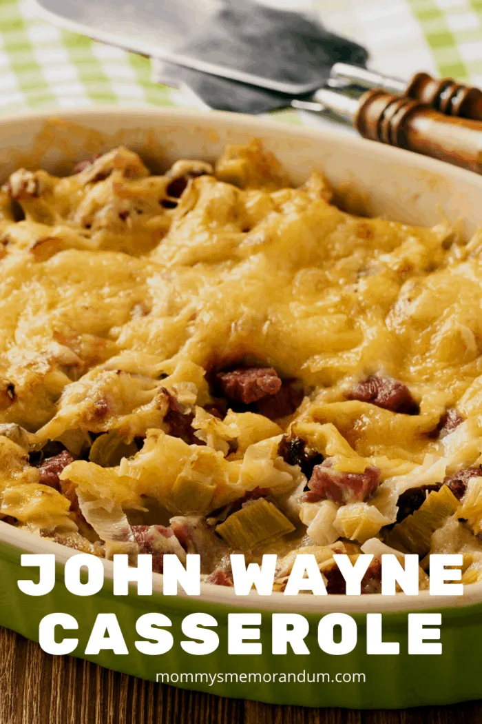 John Wayne Casserole with ground beef, tomatoes, biscuits, and melted cheddar cheese, baked to perfection.