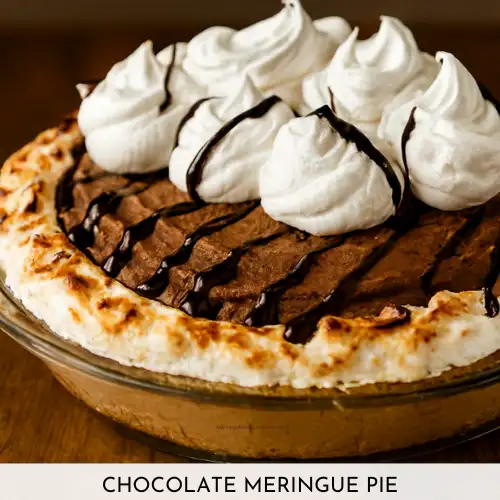 Close-up image of a Chocolate Meringue Pie in a glass pie dish with a toasted meringue crust, whipped chocolate mousse filling, chocolate drizzle, and piped whipped cream swirls. Styled with natural lighting and shallow depth of field to highlight texture and detail.