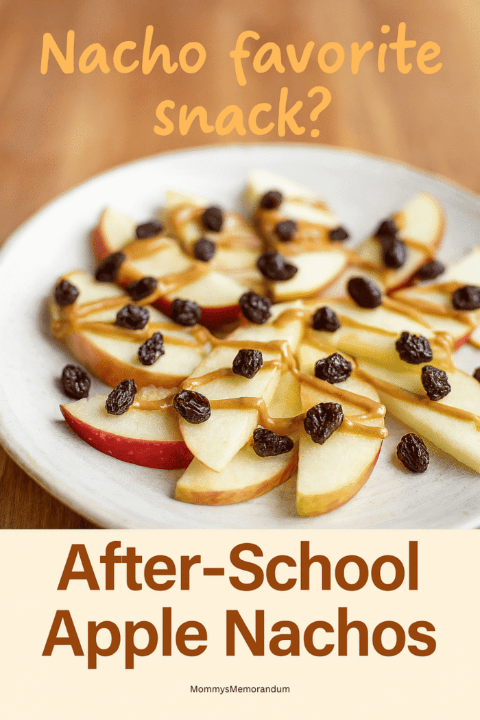 After-School Apple Nachos Bright overhead view of apple wedge nachos drizzled with peanut butter and topped with Raisinettes; styled as a playful and kid-friendly after-school snack.