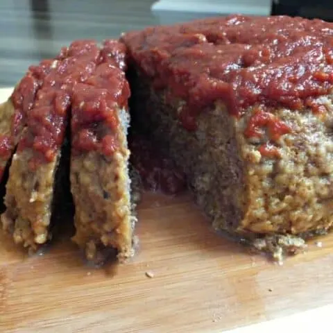 Delicious Instant Pot easy meatloaf recipe. Enjoy a traditional meatloaf recipe in half the time when cooked in your Instant Pot. It's topped with ooey gooey goodness your family will love.