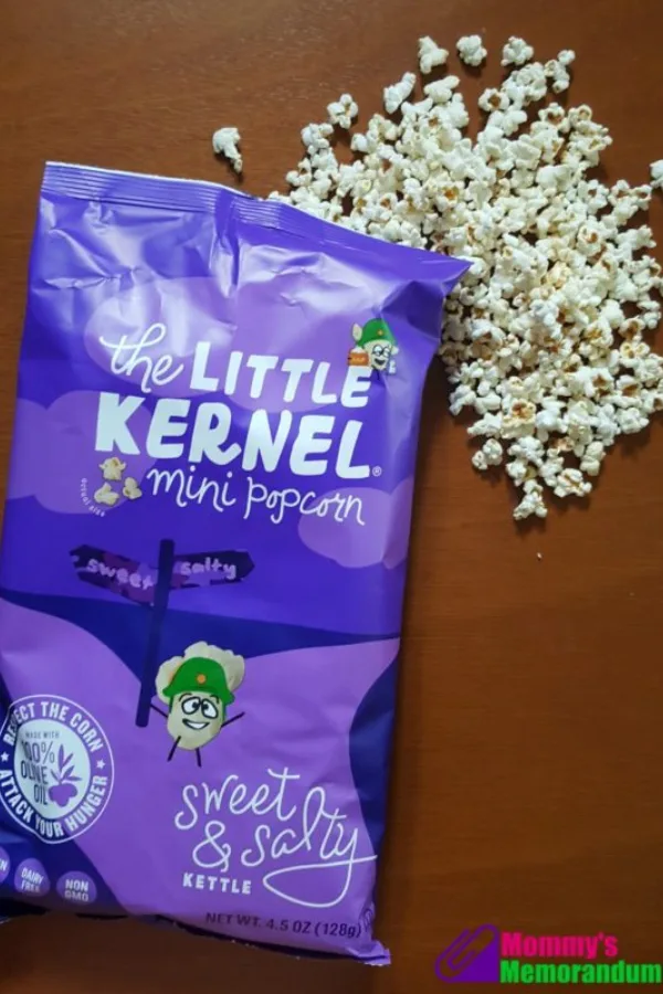 The Little Kernel Sweet & Salty popcorn next to a dime to show its small size