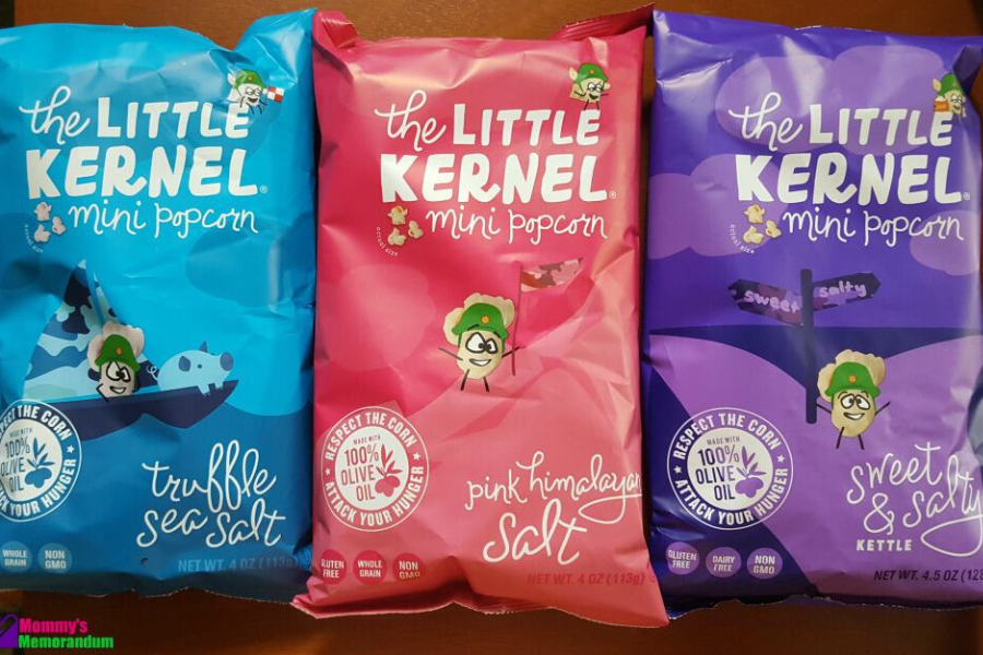 Three bags of The Little Kernel popcorn showing Sweet & Salty, Truffle Sea Salt, and White Cheddar flavors