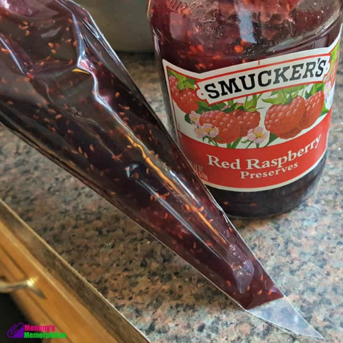 raspberry jam in piping bag