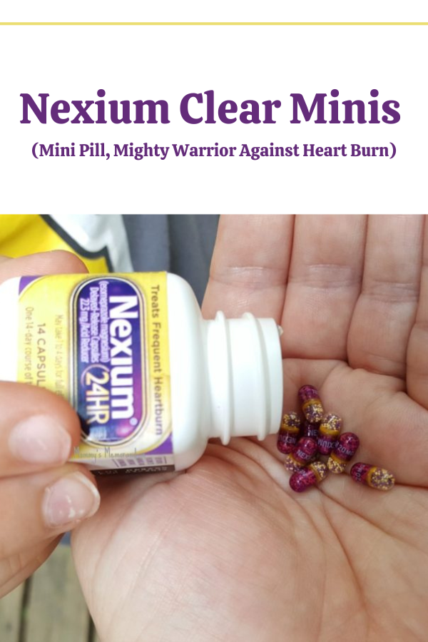 Close-up of Nexium Clear Minis capsules in hand, showcasing the smaller size compared to regular Nexium 24 HR.