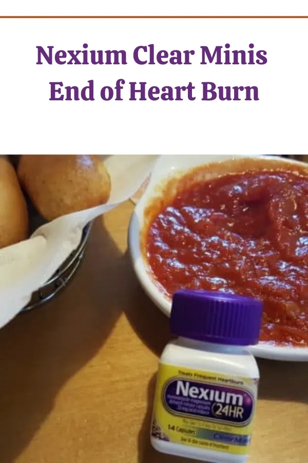 Nexium Clear Minis bottle placed next to a bowl of Italian sauce, illustrating heartburn relief with indulgent food.