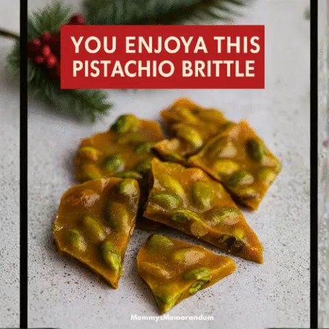 Close-up of golden pistachio brittle with vibrant green nuts, styled for the holidays with festive ribbon and evergreen accents. Crisp food photography captured as if with a Canon EOS R10 and RF 35mm macro lens.