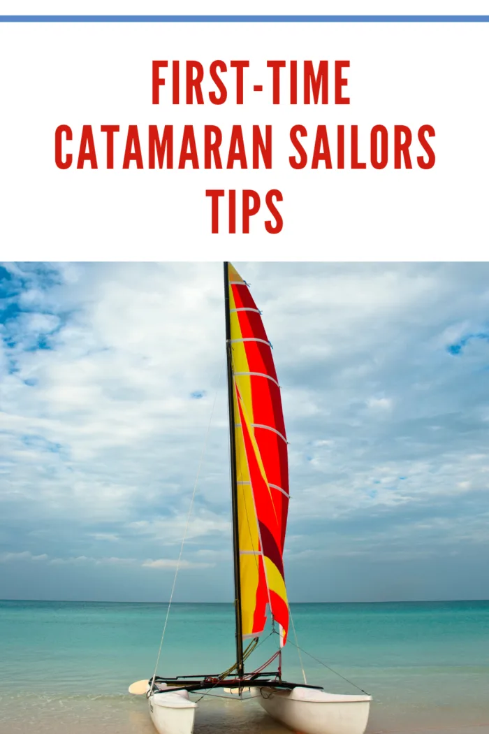 catamaran with red sails