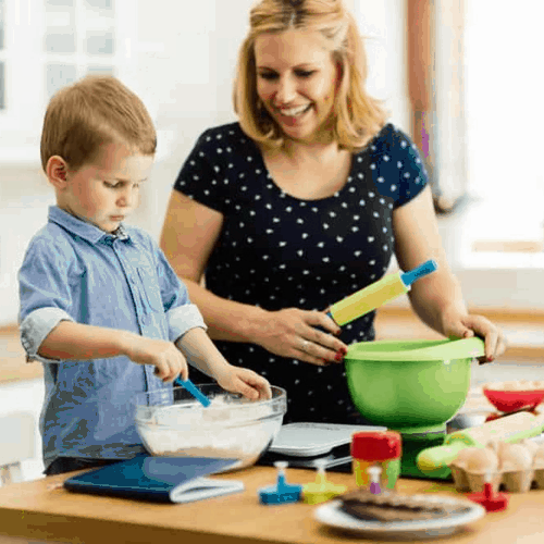 single parent making dinner with child