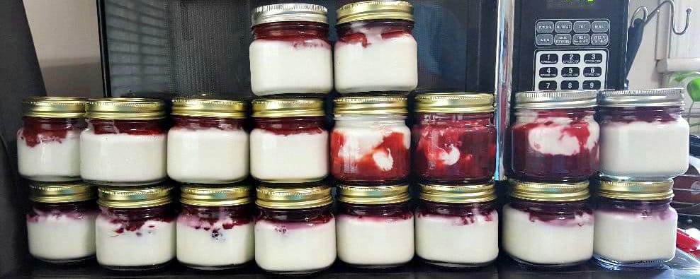 Jars of Instant Pot yogurt topped with mixed berry compote, homemade fruit topping for yogurt, healthy breakfast idea