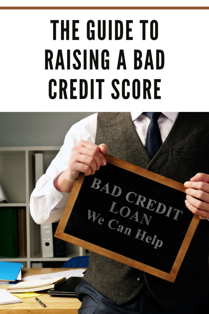 man holding bad credit loan sign