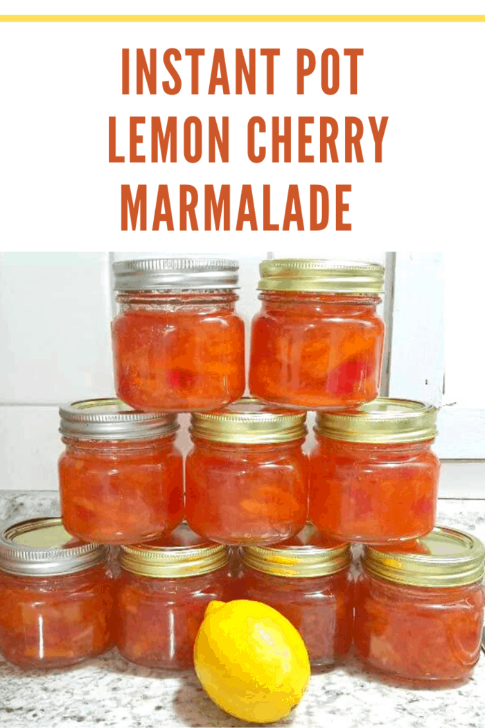 homemade instant pot lemon cherry marmalade in jars stacked in pyramid shape with lemon in front.