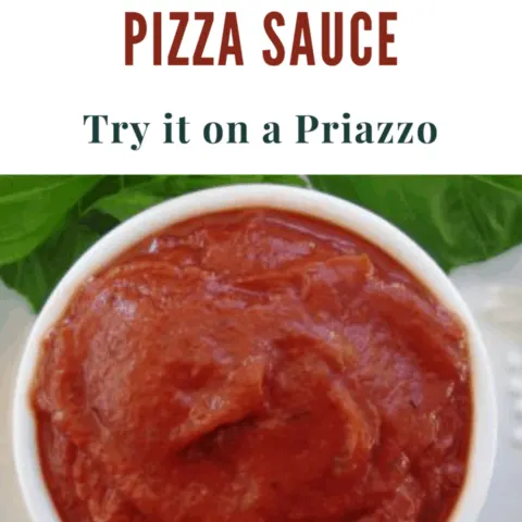 Delicious copy cat pizza hut pizza sauce in bowl with fresh basil leaves on a plate with it