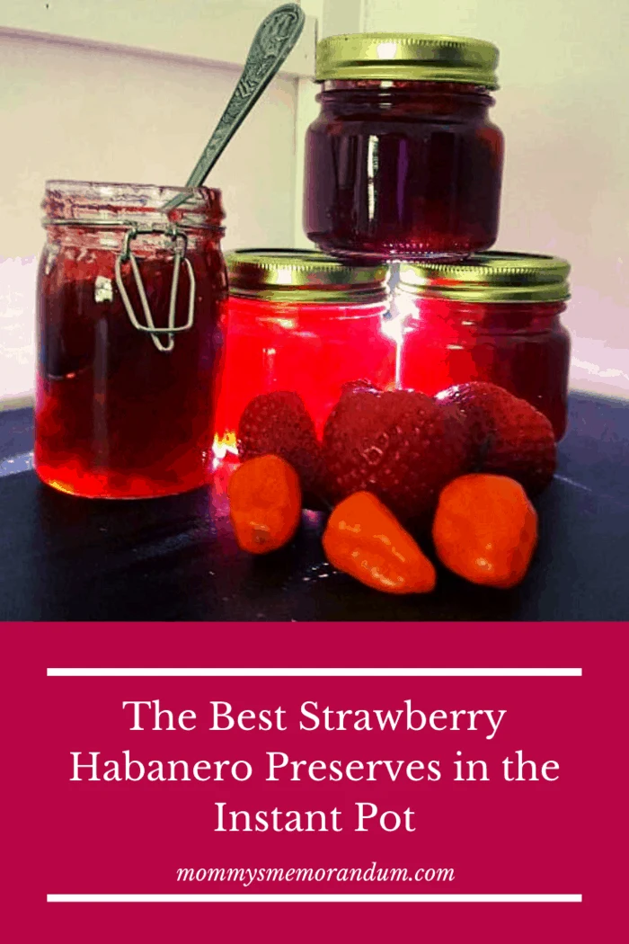 instant pot strawberry habanero preserve recipe made with light coming through jars and fresh strawberries in front of display